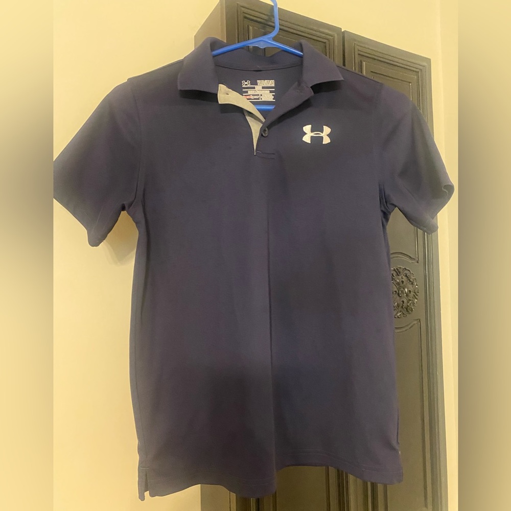 Navy blue boys UnderArmour golf shirt.